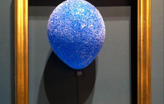 Balloonski, 6" Forever Balloon Sculpture, 2021, Covered with Blue Glass Floating in a Frame, 20” x 16” (only one in the world)